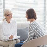 A therapist and her patient talk comfortably