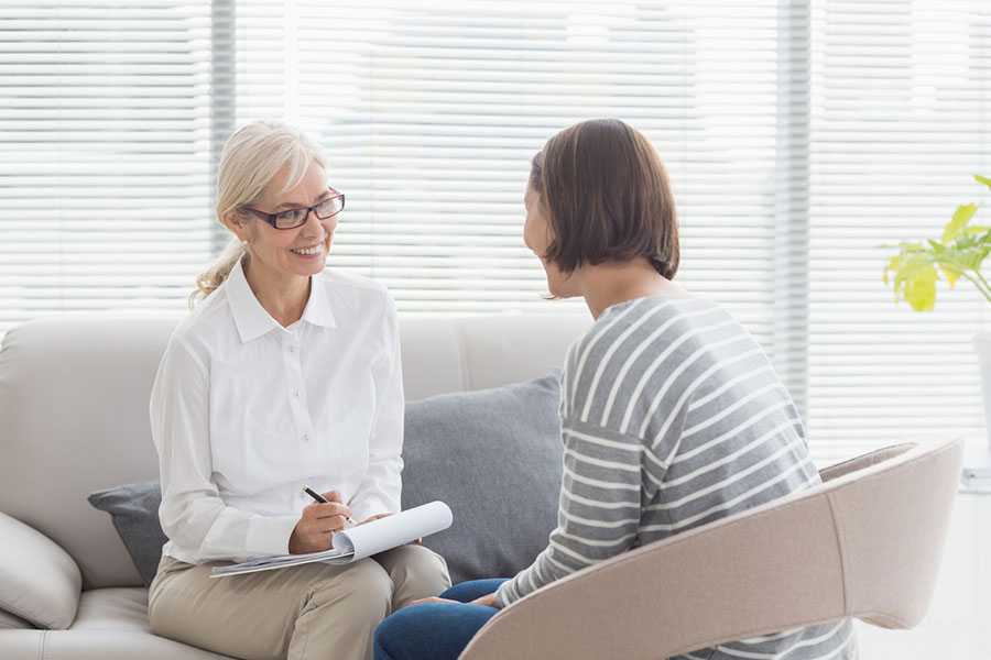 A therapist and her patient talk comfortably